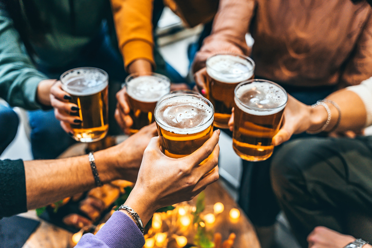 people enjoying happy hour beers